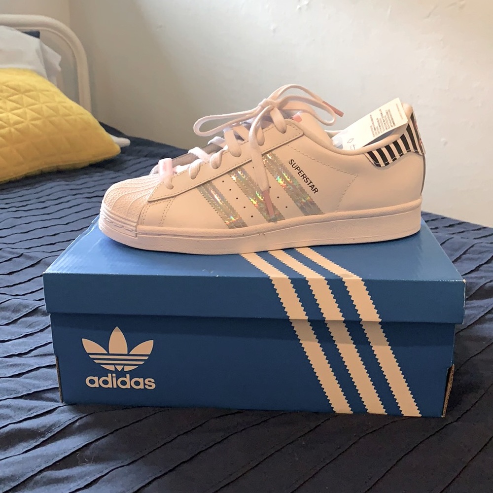 Brand new Adidas iridescent 3-stripes pair with pops of color and pattern.